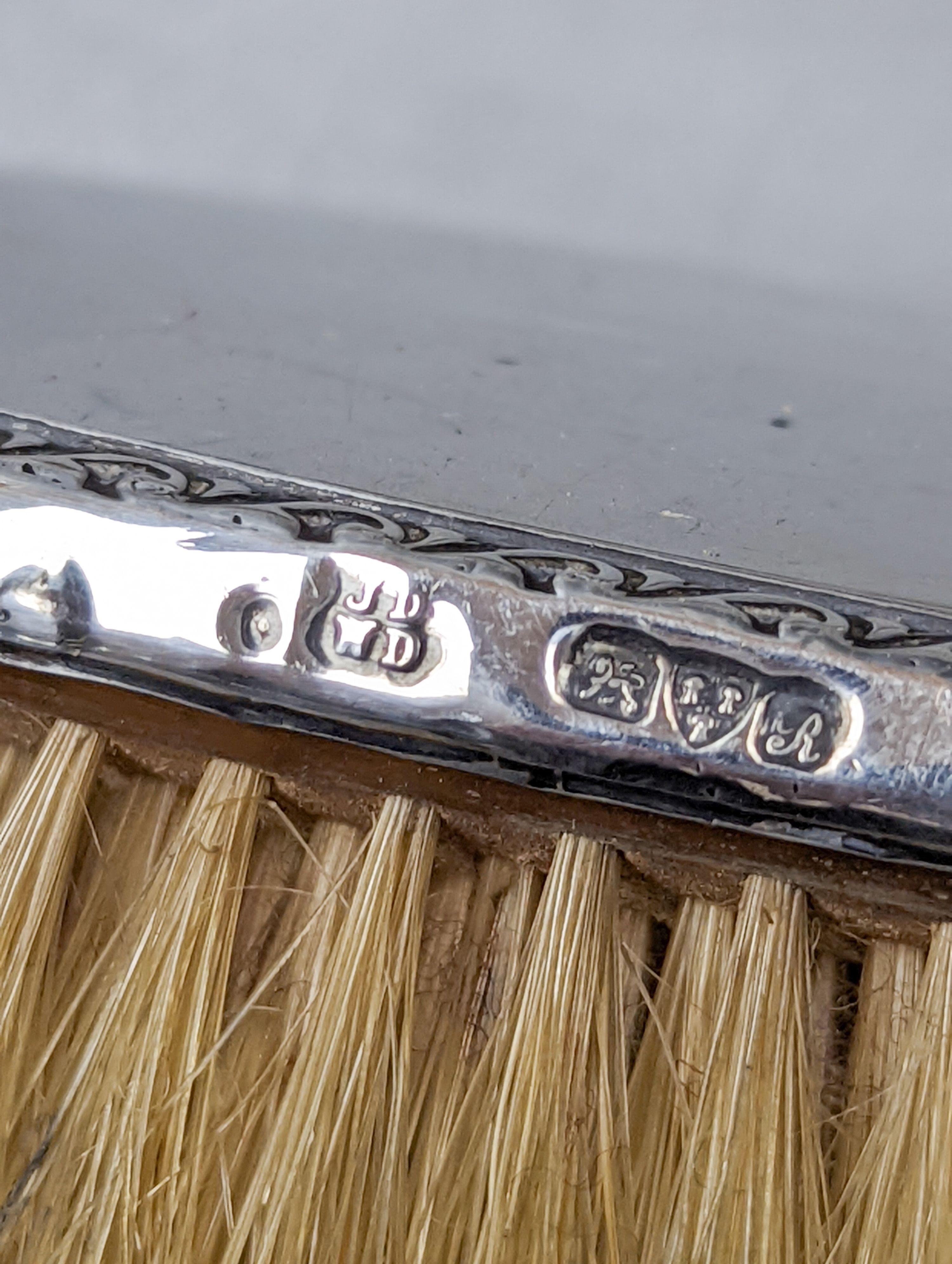 A George V silver mounted four piece mirror and brush set, Chester, 1917.